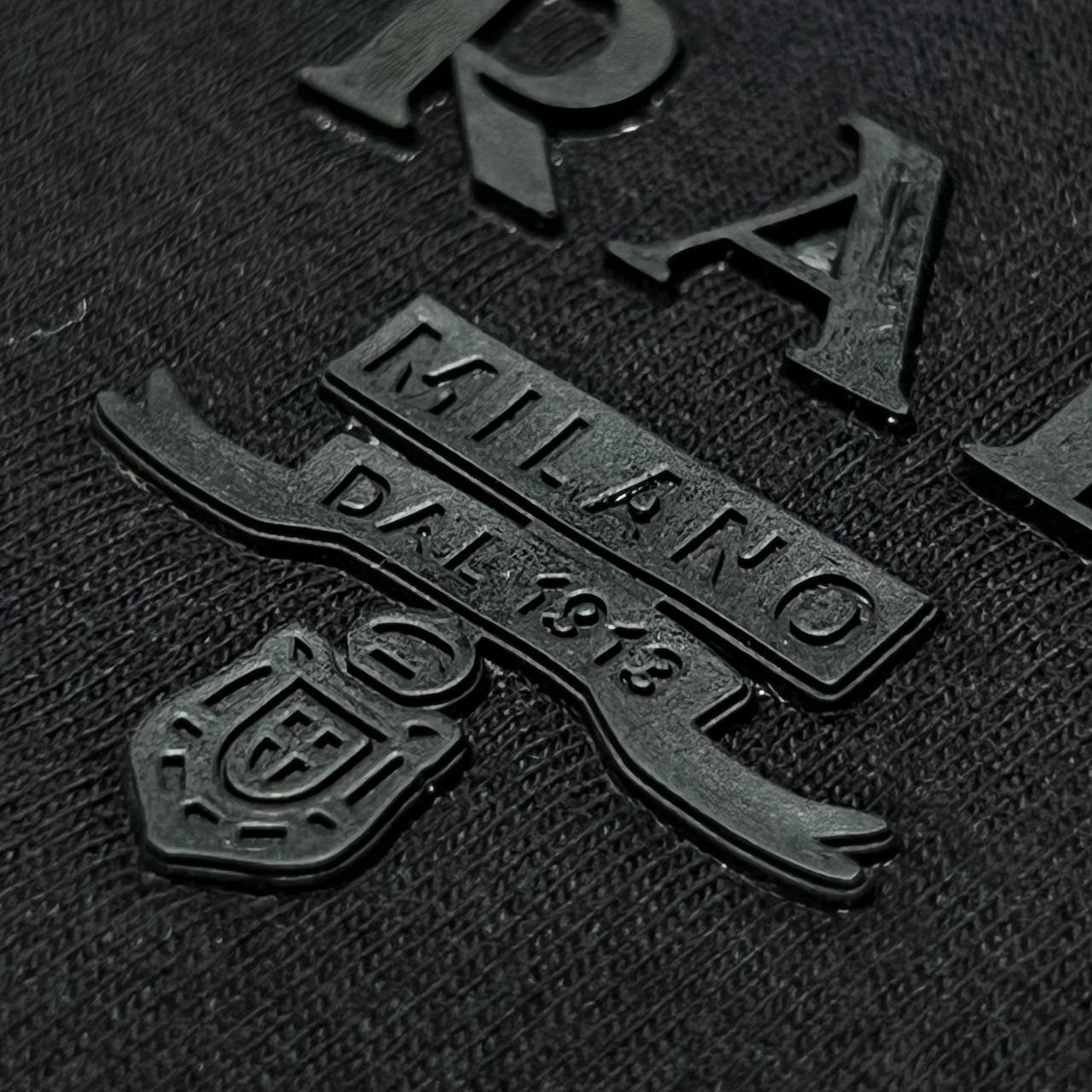 Camiseta GENUINA COTTON TANGUIS TURCO - PRADA arte em patch emborrachado