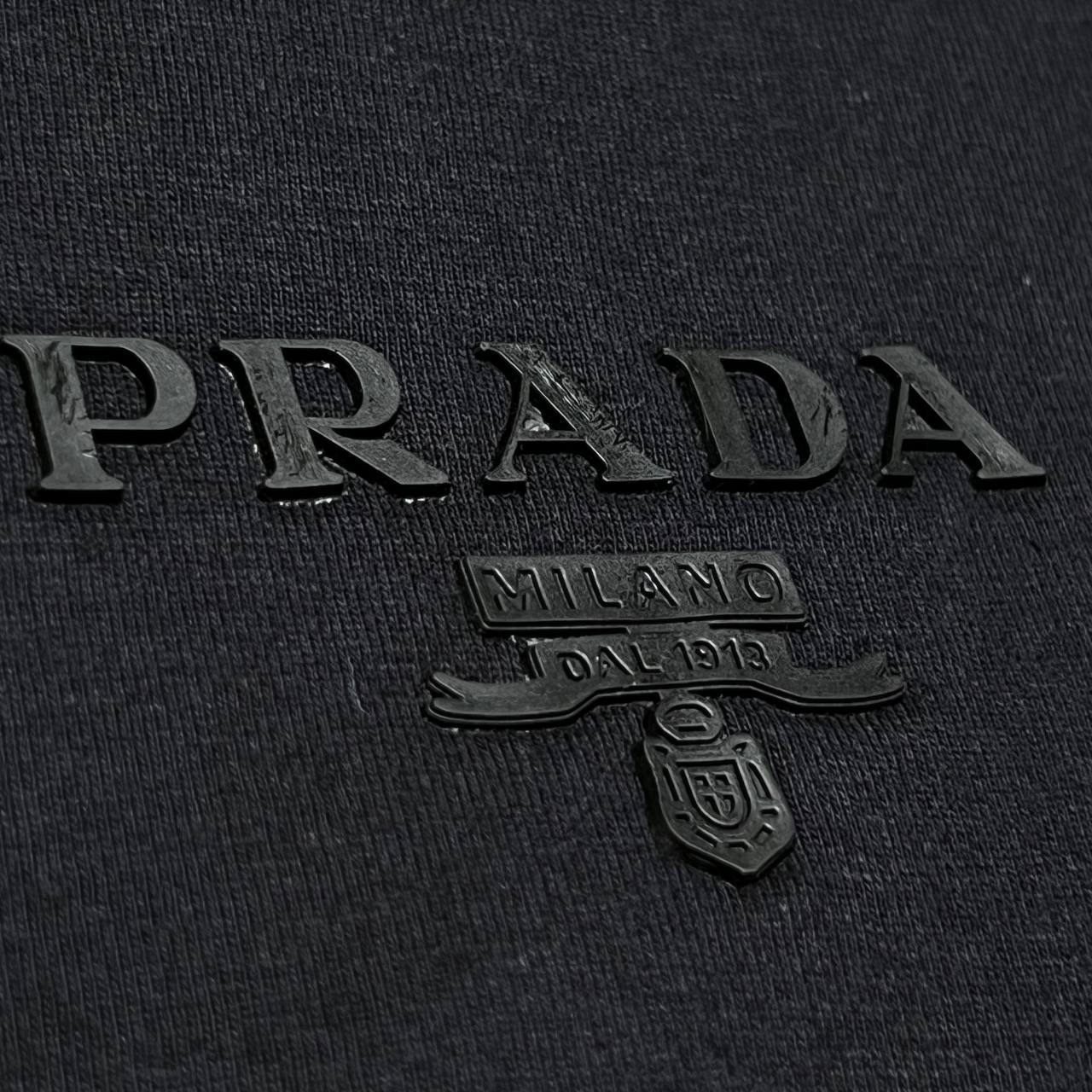 Camiseta GENUINA COTTON TANGUIS TURCO - PRADA arte em patch emborrachado